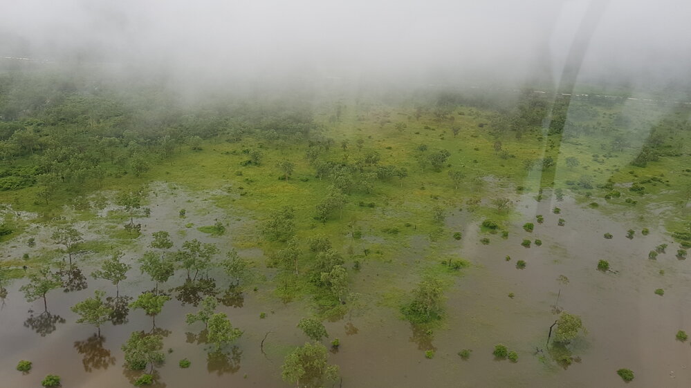 Flood waters cover rural lands, Townsville,  aerial photograph during floods, 2019.
