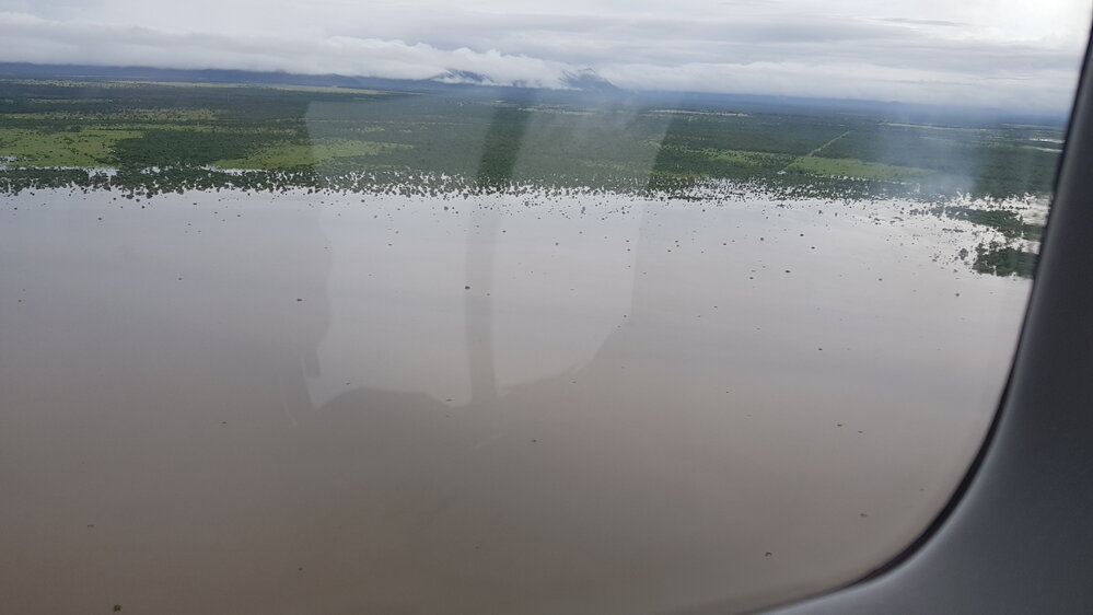 Flood waters cover rural lands, Townsville,  aerial photograph during floods, 2019.