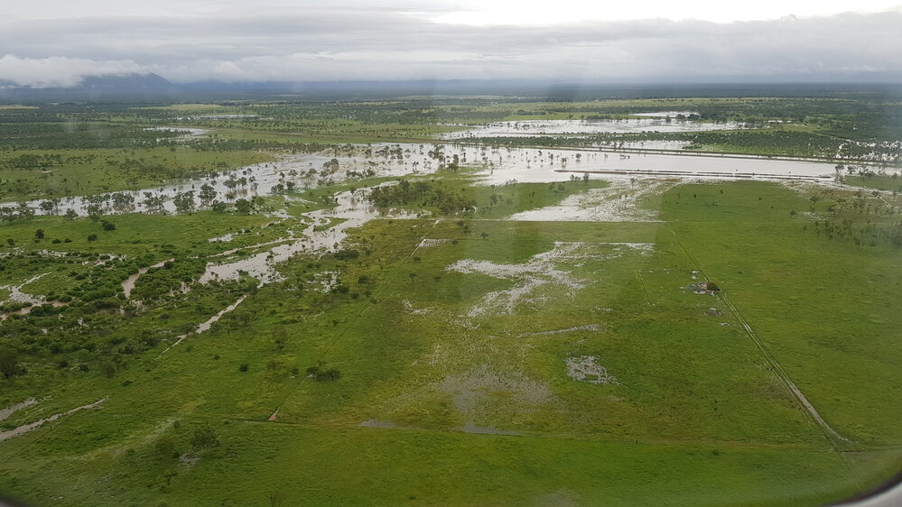 Flood waters cover rural lands, Townsville,  aerial photograph during floods, 2019.