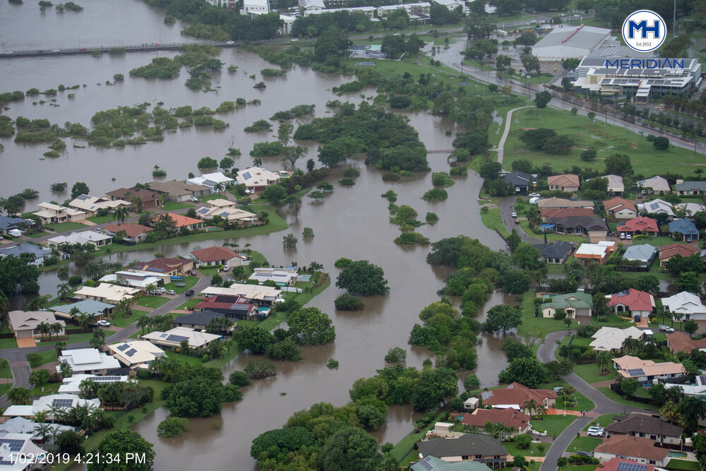 Ross River overruns banks Bowen Road, aerial photograph during floods, Annandale and Murray, 2019.