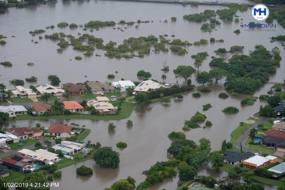 Ross River overruns banks Bowen Road, aerial photograph during floods, Annandale and Murray, 2019.