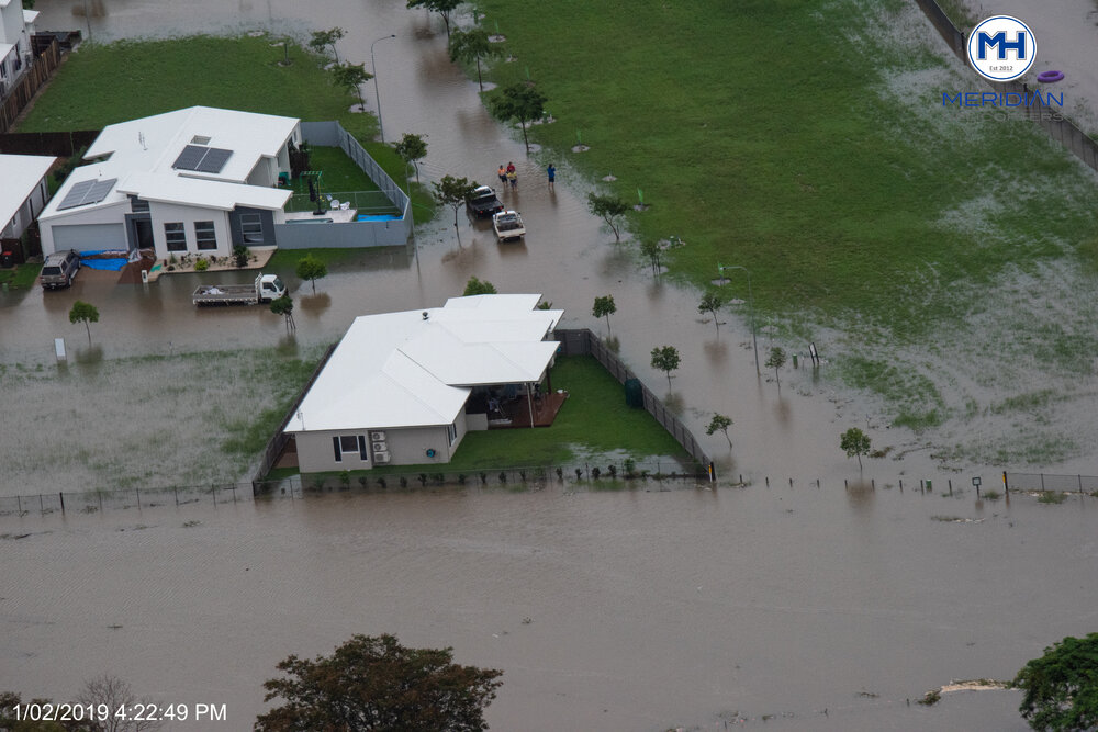 Ross River overruns banks into Idalia streets, aerial photograph during floods, Idalia, 2019. 
