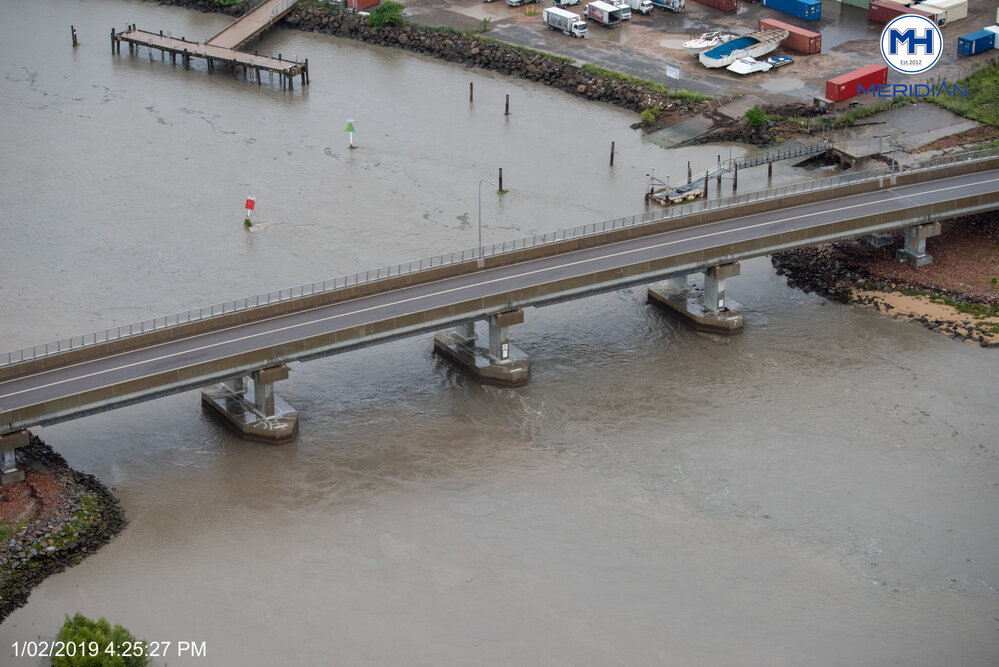 Southern Port Road bridge, old Pacific Marine Group barge unloading ramp, aerial photograph during floods, 2019. 