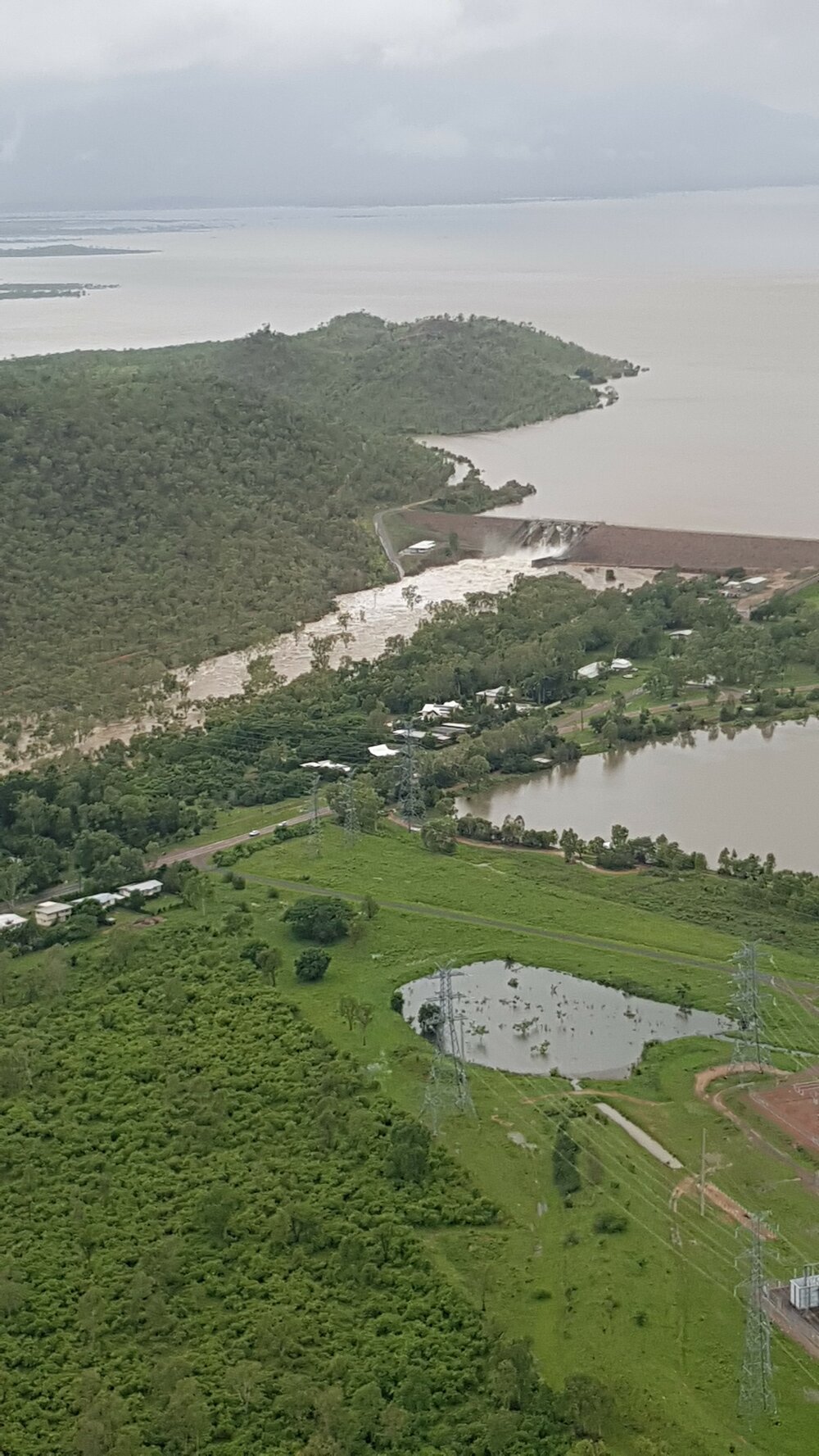 Ross River Dam Spill Way, aerial photograph during floods, 2019. 