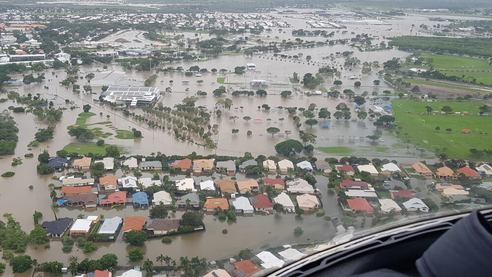Townsville Basketball Stadium, Bowen Road Bridge, aerial photograph during floods, 2019.