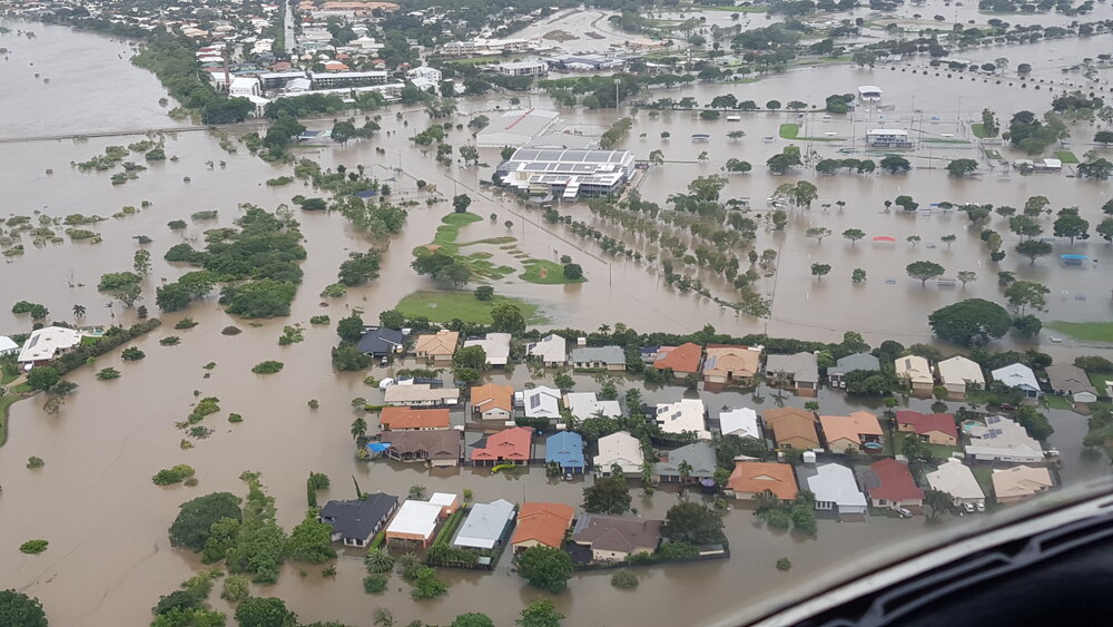 Townsville Basketball Stadium, Bowen Road Bridge, aerial photograph during floods, 2019.