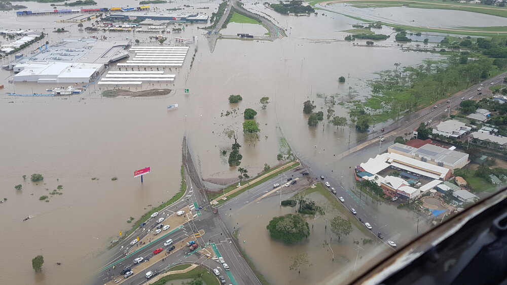 Stuart Drive Intersection, Kmart Fairfield, Townsville Turf Club, aerial photograph during floods, 2019. 