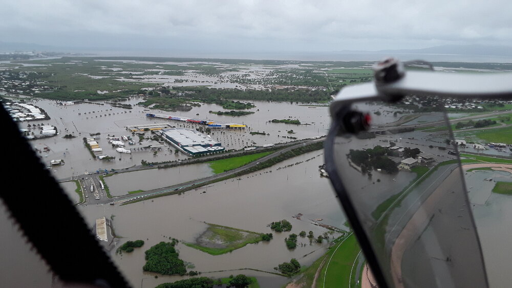 Stuart Drive Intersection, Kmart Fairfield, Townsville Turf Club, aerial photograph during floods, 2019. 