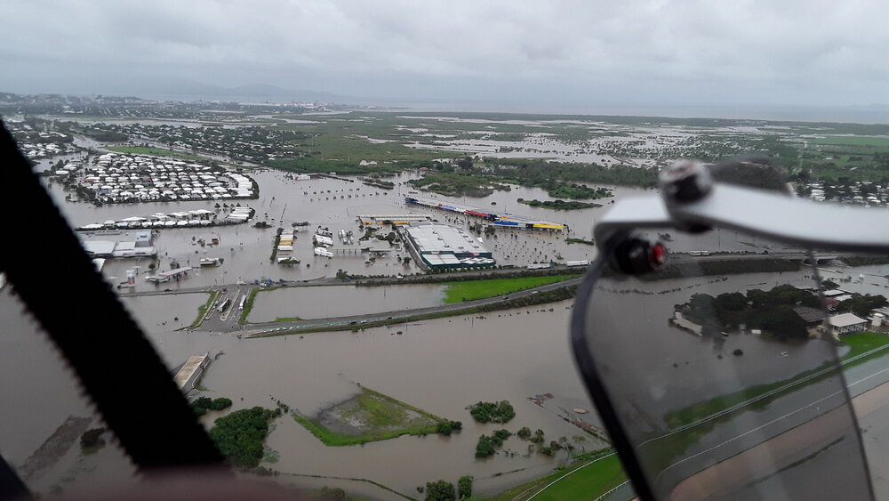 Stuart Drive Intersection, Kmart Fairfield, Townsville Turf Club, aerial photograph during floods, 2019. 