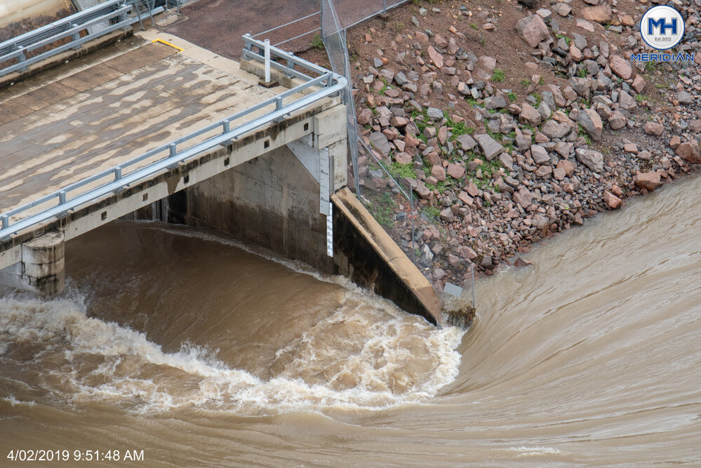 Ross River Dam Spillway, aerial photograph during floods, 2019. 