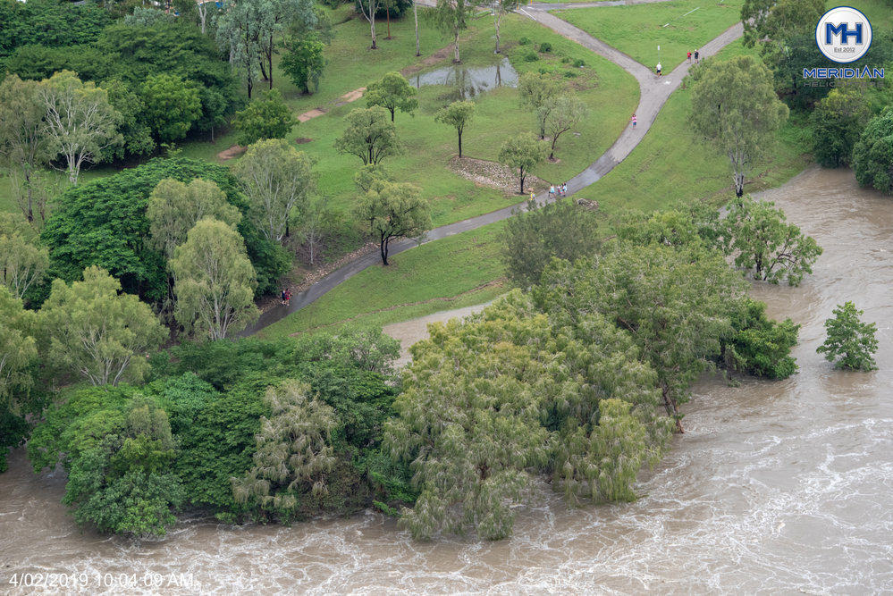 Ross River, Pedestrians on Riverside Gardens footpath, Douglas, aerial photograph during floods, 2019. 