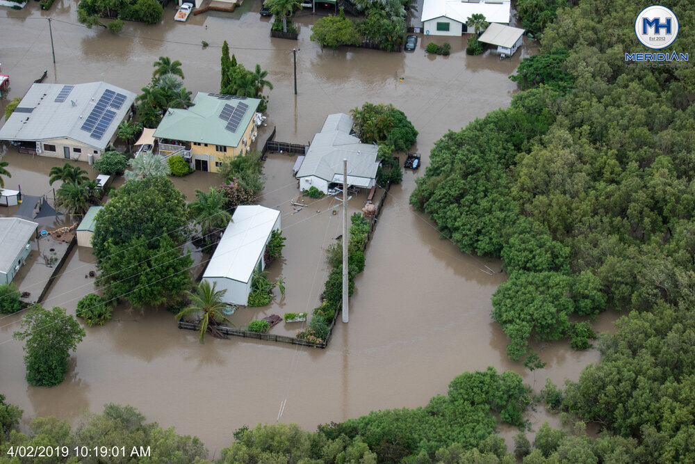Boats, inundated streets, aerial photograph during floods, 2019. 