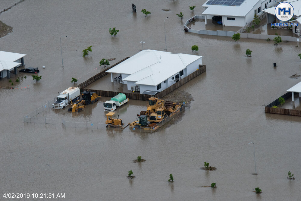 Earth moving equipment inundated, Idalia, aerial photograph during floods, 2019. 