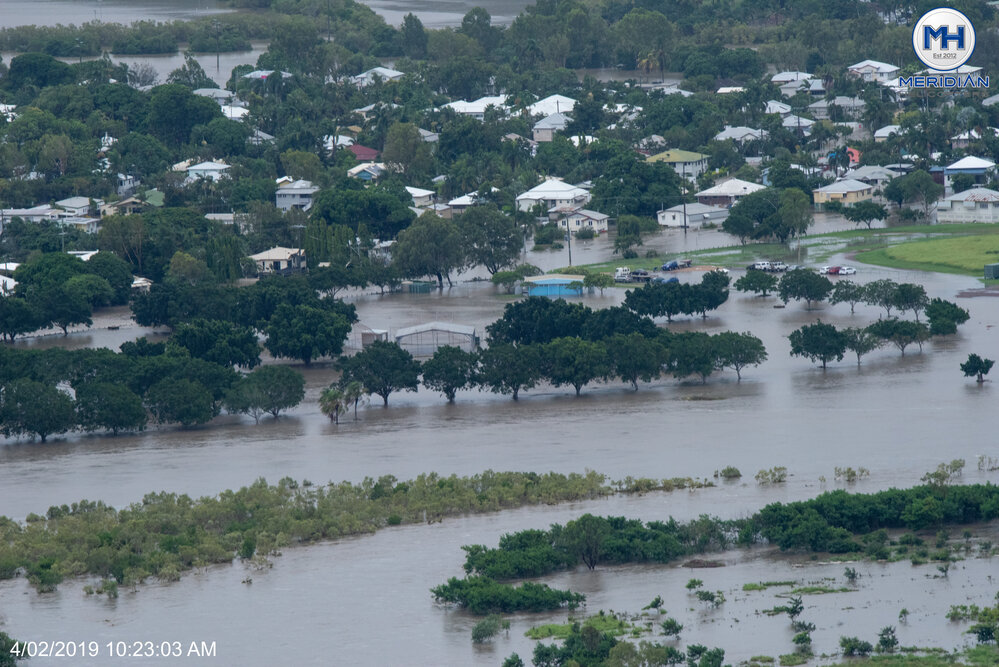 Ross River burst banks inundating Bicentennial Park and Queens Road, aerial photograph during floods, 2019. 