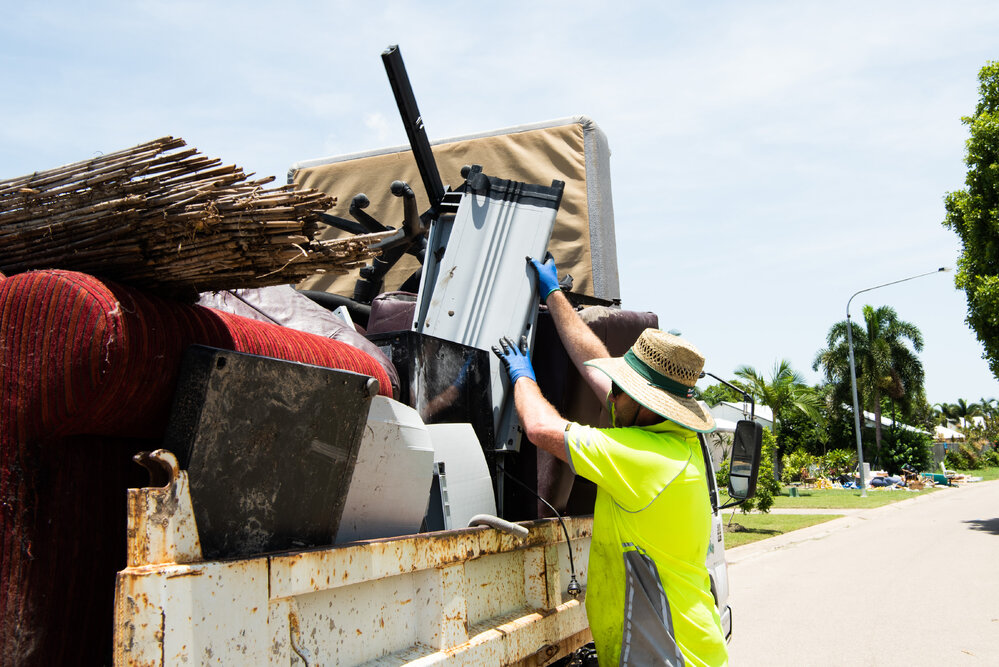 SES and resident volunteers clear away flood damaged home contents, Annandale, 2019.