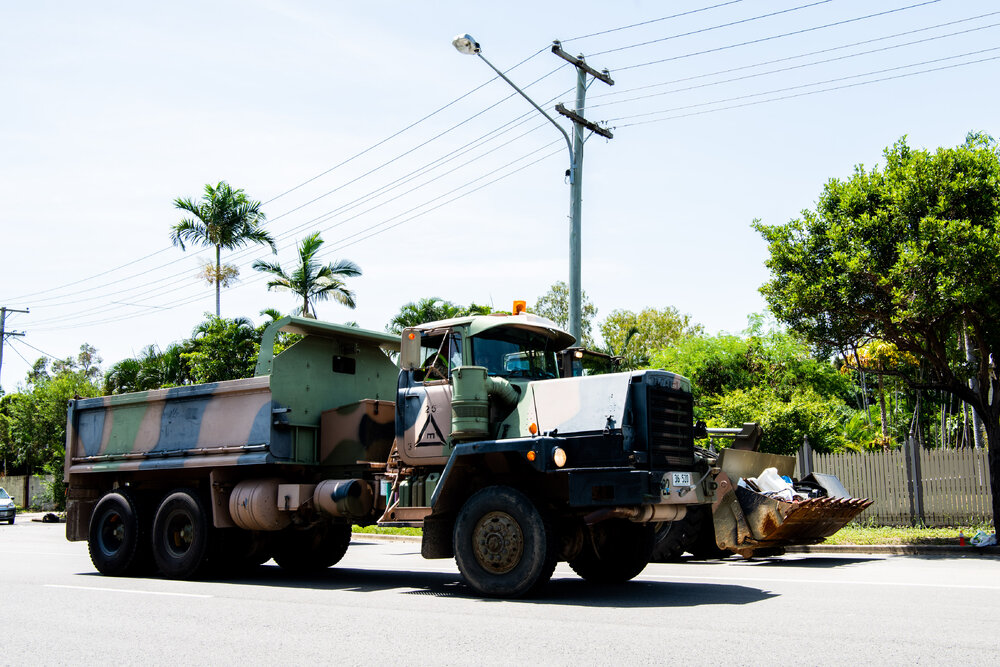 Army volunteers clear away flooded home contents, Railway Estate, 2019. 