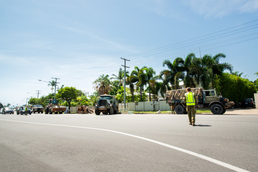 Army volunteers clear away flooded home contents, Railway Estate, 2019. 