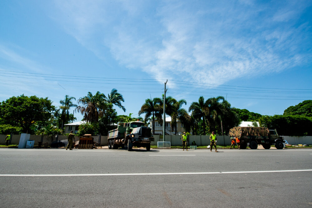 Army volunteers clear away flooded home contents, Railway Estate, 2019. 