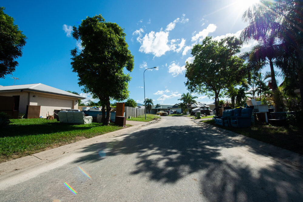 Damaged household goods lining streets of flood affected street, Idalia, 2019