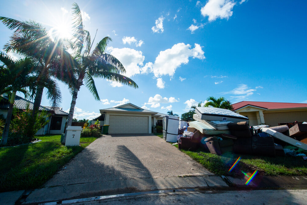 Damaged household goods lining streets of flood affected street, Idalia, 2019