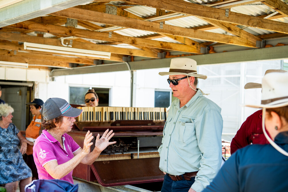Councillor Les Walker talking with residents during the flood clean up, Oonoonba, 2019.