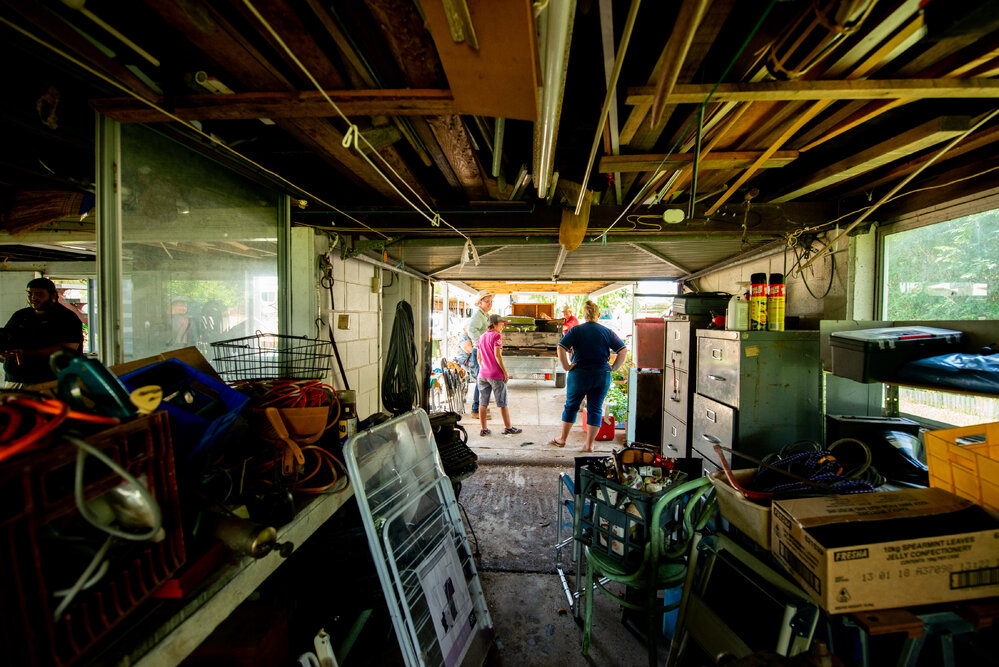 Councillor Les Walker talking with residents during the flood clean up, Oonoonba, 2019.