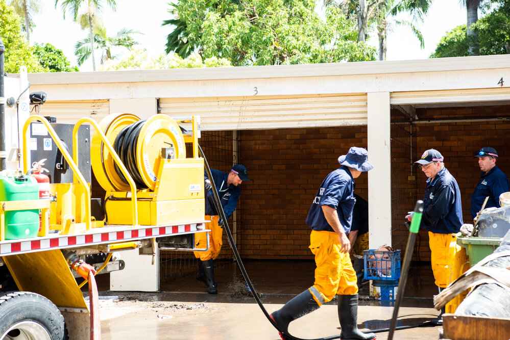 Rural Fire Service Queensland clean up homes after floods, 2019. 