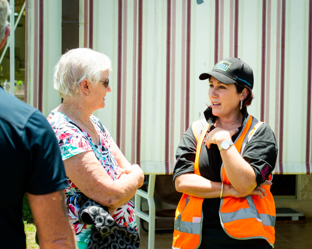 Cr Ann-Maree Greaney with flood-affected resident, 2019.