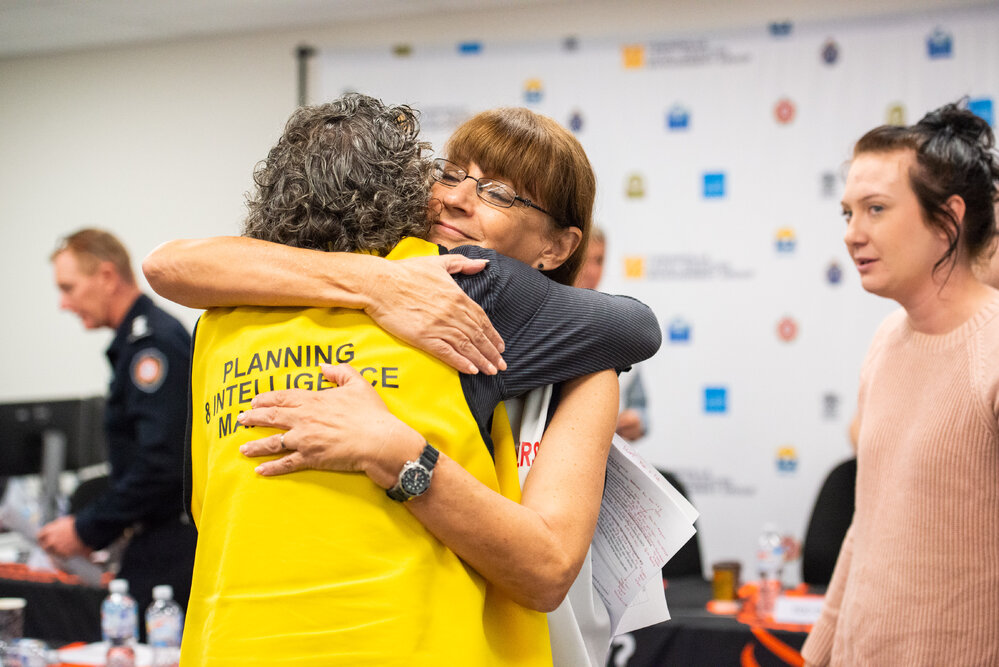 Mayor Jenny Hill and Darron Irwin Planning and Intelligence Manager embrace, Disaster Committee Meeting, 2019