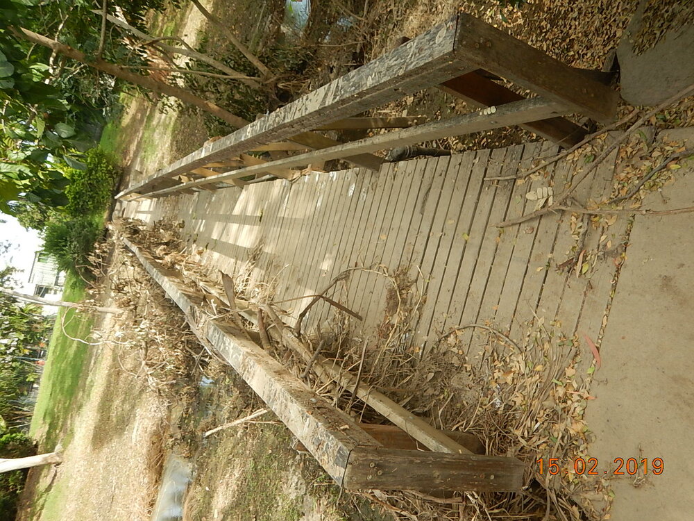 Debris covered bridge at Borina Park, Annandale after flood, 2019. 