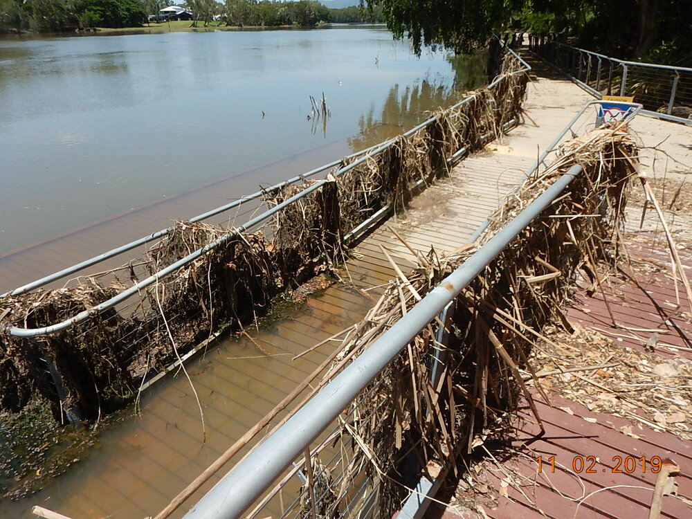 Submerged and debris covered Riverway boardwalk, 2019. 