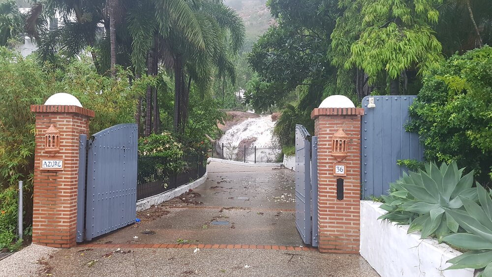 Rain cascading down Castle Hill during floods, 2019.