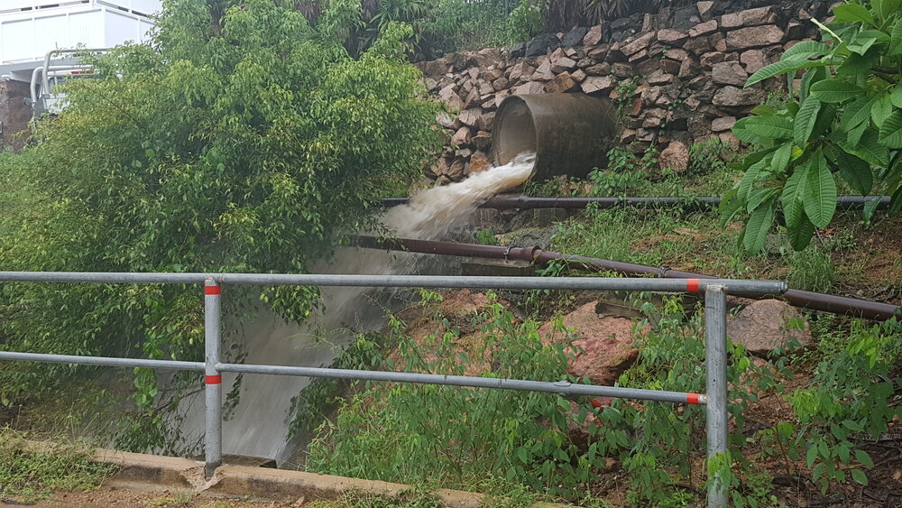Torrential rains stream down storm water system, Yarrawonga, 2019. 