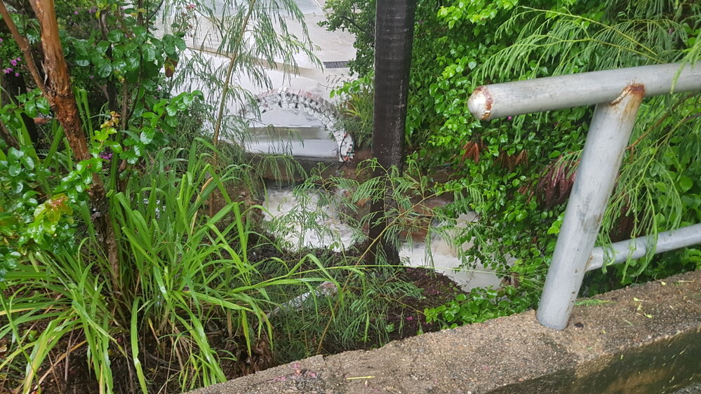 Torrential rains stream down storm water system, Castle Hill, 2019. 