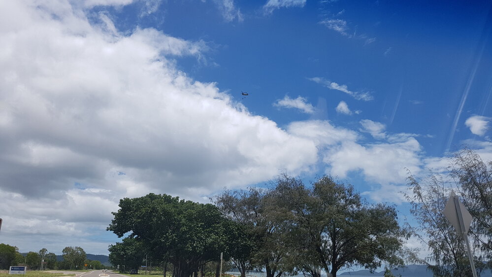 Army Helicopter with airdrop cargo flying over Cape Pallarenda, 2019. 