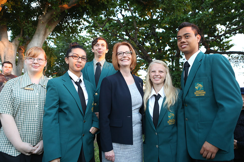Prime Minister Julia Gillard with students from Heatley Secondary College at the ANZAC Day commemoration at the Cenotaph, the Strand, Townsville, 25 April 2013