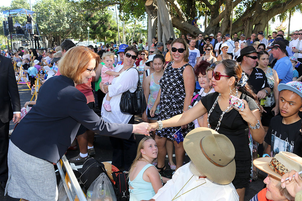 Prime Minister Julia Gillard speaks with spectators at the ANZAC Day parade, the Strand, Townsville, 25 April 2013