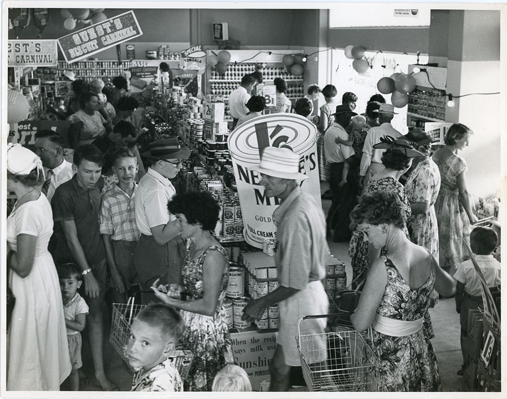 Customers and promotional displays at Philip Leong's Hermit Park store, Townsville, 1950s