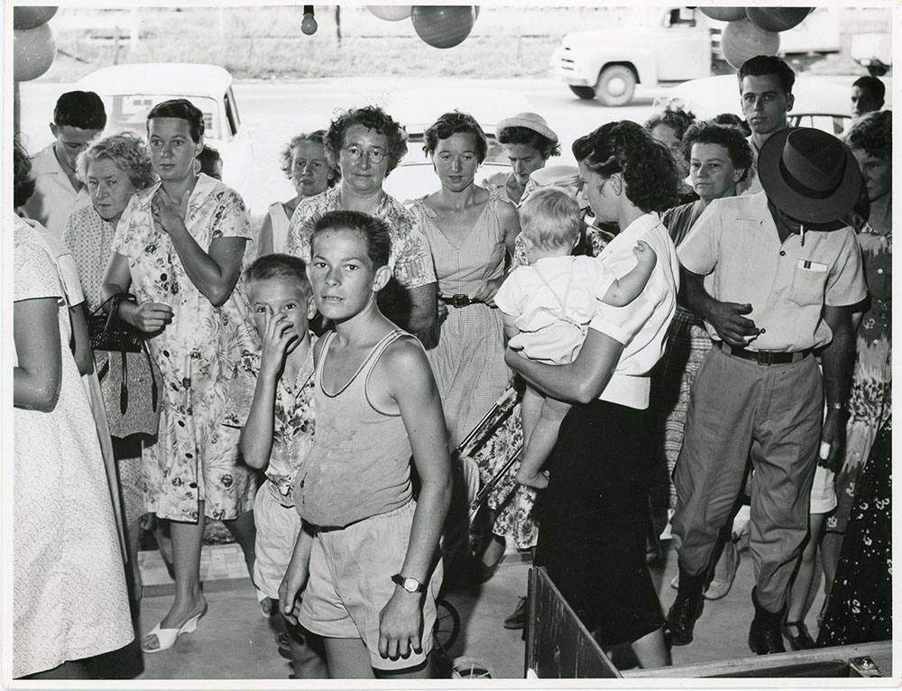 Customers waiting for the opening of Philip Leong's Hermit Park store, Townsville, 1950s