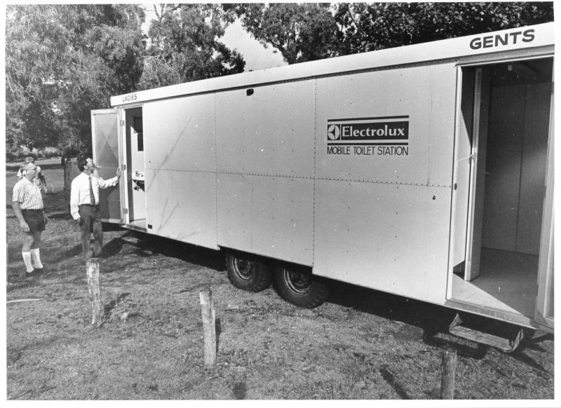 Alderman Kel Griffith and Recreation Officer, John Rogers, inspect the newly arrived mobile toilets. Townsville, 4th August 1975. 