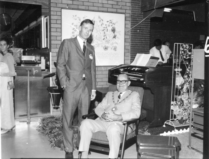 Mayor, Alderman Harold Phillips (seated) with Mr. Bob Knox, Woolworth's Northern Division Supervisor, at the official opening of Woolworth's Big W store in Flinders Street, Townsville, 12th March 1969. 