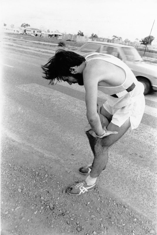 Paul Circosta of the Brisbane Rangers Club, is exhausted after winning the Marathon race along Hervey's Range and Ross River Roads, held by the Townsville Marathon Club, 23 September 1973
