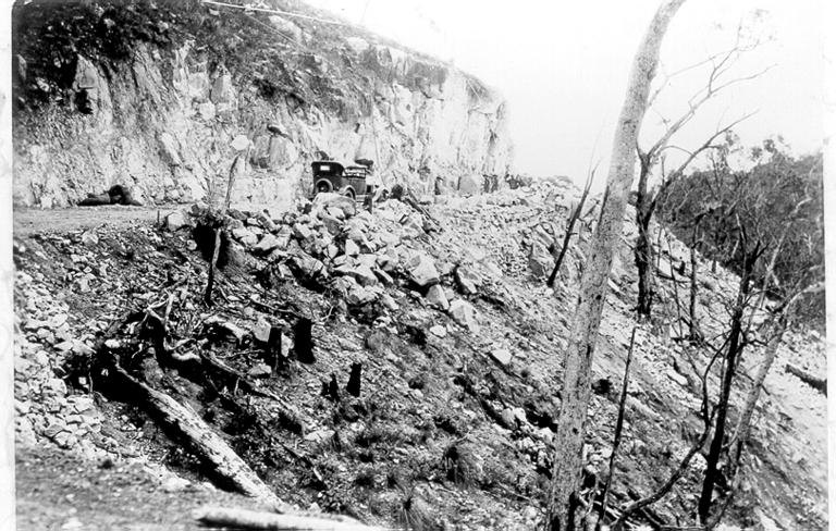 Mount Spec, stone cutting during construction of Mount Spec road, ca 1930 
