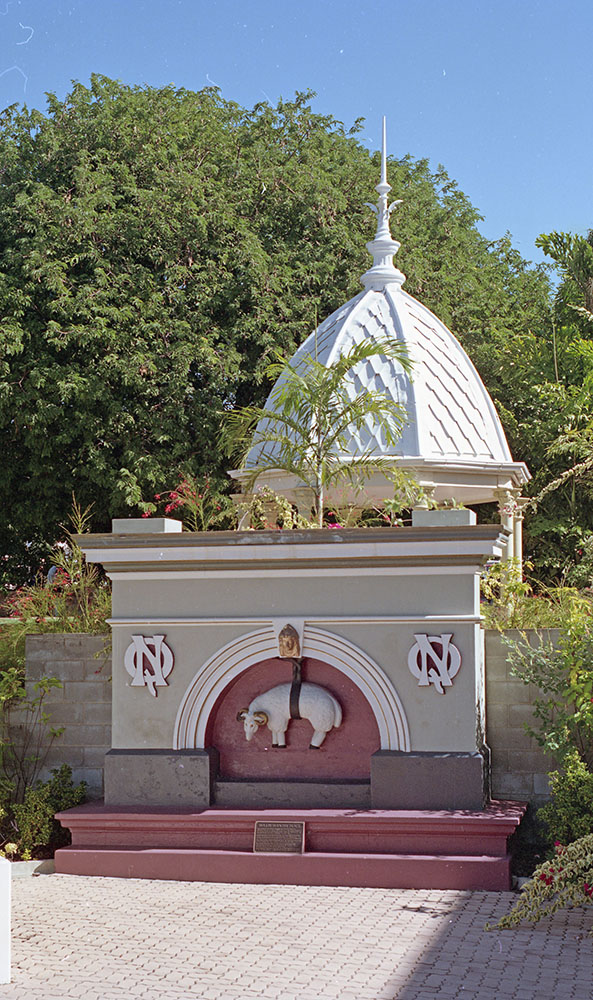 Golden Fleece pediment from the Hollis Hopkins Building in Sturt Street and the Cupola from the Town Hall building in Flinders Street in the Perfume Gardens, Townsville, 1991