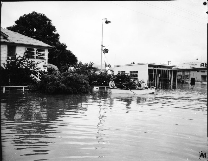 Flooding on Charters Towers Road, near the Ampol service station, Townsville, 30 January 1965