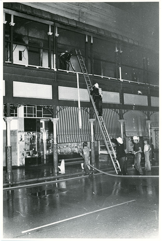 Firemen attending the Town Hall fire, Flinders Street, Townsville, 1978. 