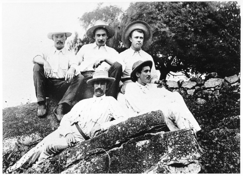A. O. Jackson photographs - group of men sitting on rocks. 