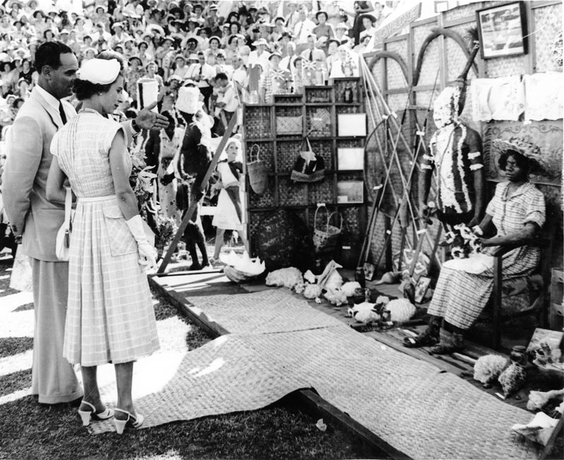 Mayor Angus Smith shows Queen Elizabeth the Palm Island display at the civic reception at the Sports Reserve, Townsville, March 1954. 