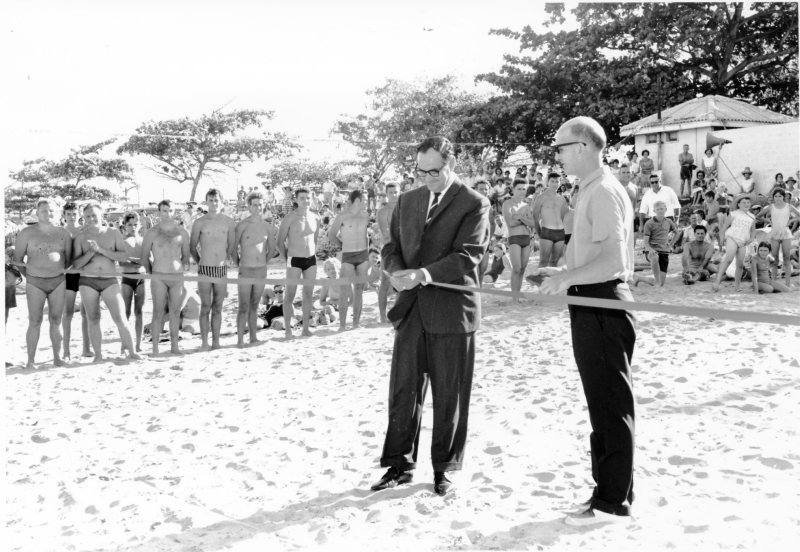 The Mayor, Alderman Angus Smith, cuts the ribbon at the official opening of the Pallarenda Baths, 5th November 1966. 