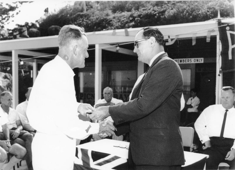 Townsville Mayor, Alderman Angus Smith shakes hands with Les Finnerty at the official opening of the Picnic Bay Surf Life Saving Club clubhouse, 4th December, 1966. 